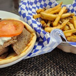 Pozi's Greek House - The classic pita gyro sandwich with their awesome fries... you can't eat the whole thing in one sitting.... BIG portions