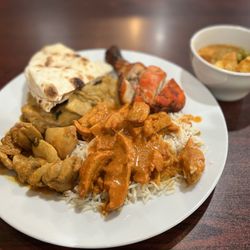 Friends Indian Cuisine  - Butter Chicken over rice, Chicken Curry, Tandoori Chicken, fresh Naan, and Palak Paneer