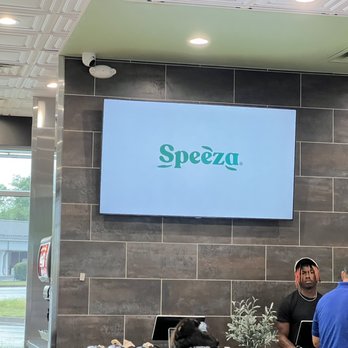 Speeza - two men standing in front of a tv - Mediterranean Near Me - Bowling Green, Kentucky