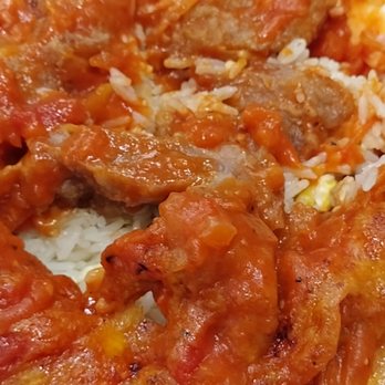 New Fusion - Supposed to be baked pork chops, but it turned out to be sliced pork in tomato sauce. - Asian Fusion Near Me - Arcadia, California