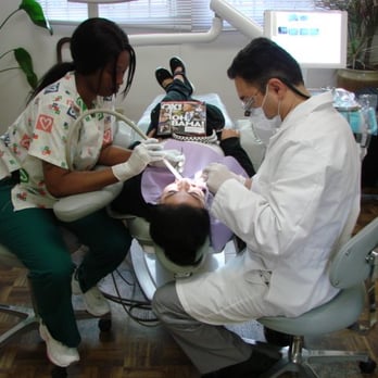 Farzin Farhan, DDS - Farzin Farhan, DDS Working on a Happy Patient-Local Dentist Near Los Angeles - General Dentistry Near Me - Los Angeles, California