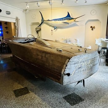 Tempest Oyster Bar - A wishing well boat in the middle of a room where you can dine - Bars Near Me - Madison, Wisconsin Tempest Oyster Bar - A wishing well boat in the middle of a room where you can dine - Bars Near Me - Madison, Wisconsin
