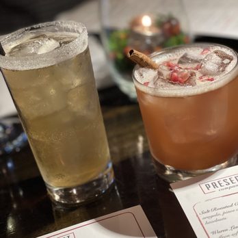 Present Company - two drinks on a table - New American Near Me - Simsbury, Connecticut Present Company - two drinks on a table - New American Near Me - Simsbury, Connecticut