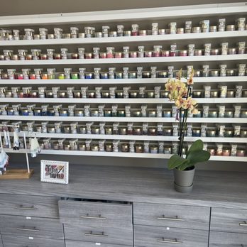 Unik Nail Spa - A portion of their selection of nail colors. - Nail Salons Near Me - Riverside, California