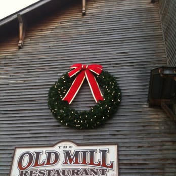 Old Mill Restaurant - Holiday wreath on the exterior of the old mill - American Near Me - Pigeon Forge, Tennessee Old Mill Restaurant - Holiday wreath on the exterior of the old mill - American Near Me - Pigeon Forge, Tennessee