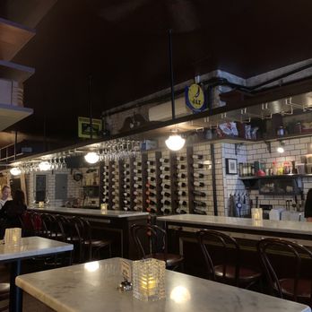 Vanguard Wine Bar - rows of wine glasses on tables - Wine Bars Near Me - New York, New York Vanguard Wine Bar - rows of wine glasses on tables - Wine Bars Near Me - New York, New York