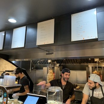 Muncheez - three men working in a restaurant kitchen - Lebanese Near Me - Washington, DC, District of Columbia Muncheez - three men working in a restaurant kitchen - Lebanese Near Me - Washington, DC, District of Columbia