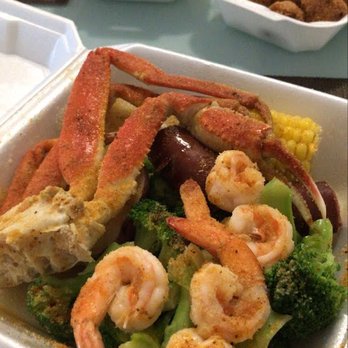 Cajun Seafood - This is the D3 and in the background are hushpuppies and fries! Sooo tasty! - Cajun/Creole Near Me - Jacksonville, North Carolina