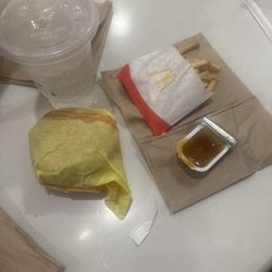 McDonald's - I Order a hot and spicy with cheese bundle deal and onions and an extra cheeseburger and only got one . Where is my nuggets