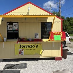 Outside. Perfect day for tacos and elote!