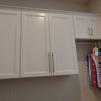 Custom Closet Guys - functional laundry room [cabinets, hanging rack] - Cabinetry Near Me