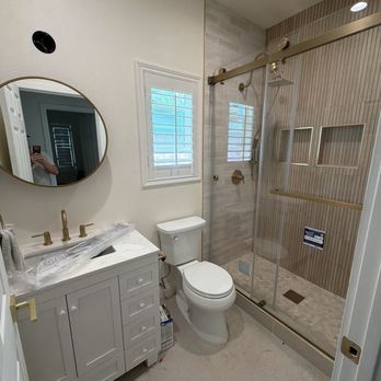Glass Express - Installed the shower door with gold hardware and a towel rack - Glass & Mirrors Near Me Glass Express - Installed the shower door with gold hardware and a towel rack - Glass & Mirrors Near Me