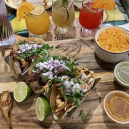 Tacos de carnitas, carne asada, pollo asado. With rice and salsa verde y roja.