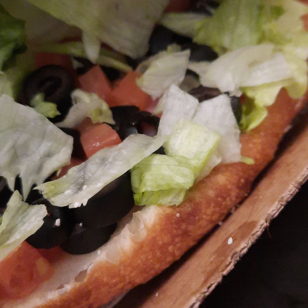 Jet's Pizza - Deli boat with black olives added - Pizza Near Me - New Hudson, Michigan Jet's Pizza - Deli boat with black olives added - Pizza Near Me - New Hudson, Michigan