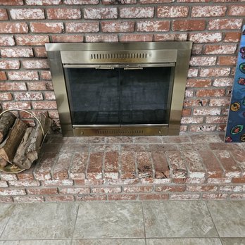 Soot Removers - Fireplace after being cleaned, Tikar does an amazing job with the cleanup on the outside too, after cleaning out the fireplace. - Chimney Sweeps Near Me