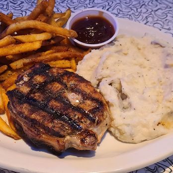 Bubba's 33 - Pork Chop with 2 sides of mashed potatoes and fries. - Burgers Near Me - Avon, Indiana