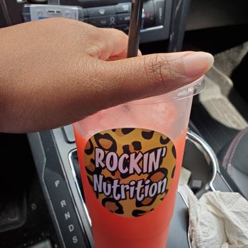 Rockin’ Nutrition - a hand holding a drink in a cup - Juice Bars & Smoothies Near Me - Memphis, Tennessee Rockin’ Nutrition - a hand holding a drink in a cup - Juice Bars & Smoothies Near Me - Memphis, Tennessee