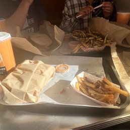 a tray of fries and a sandwich a tray of fries and a sandwich
