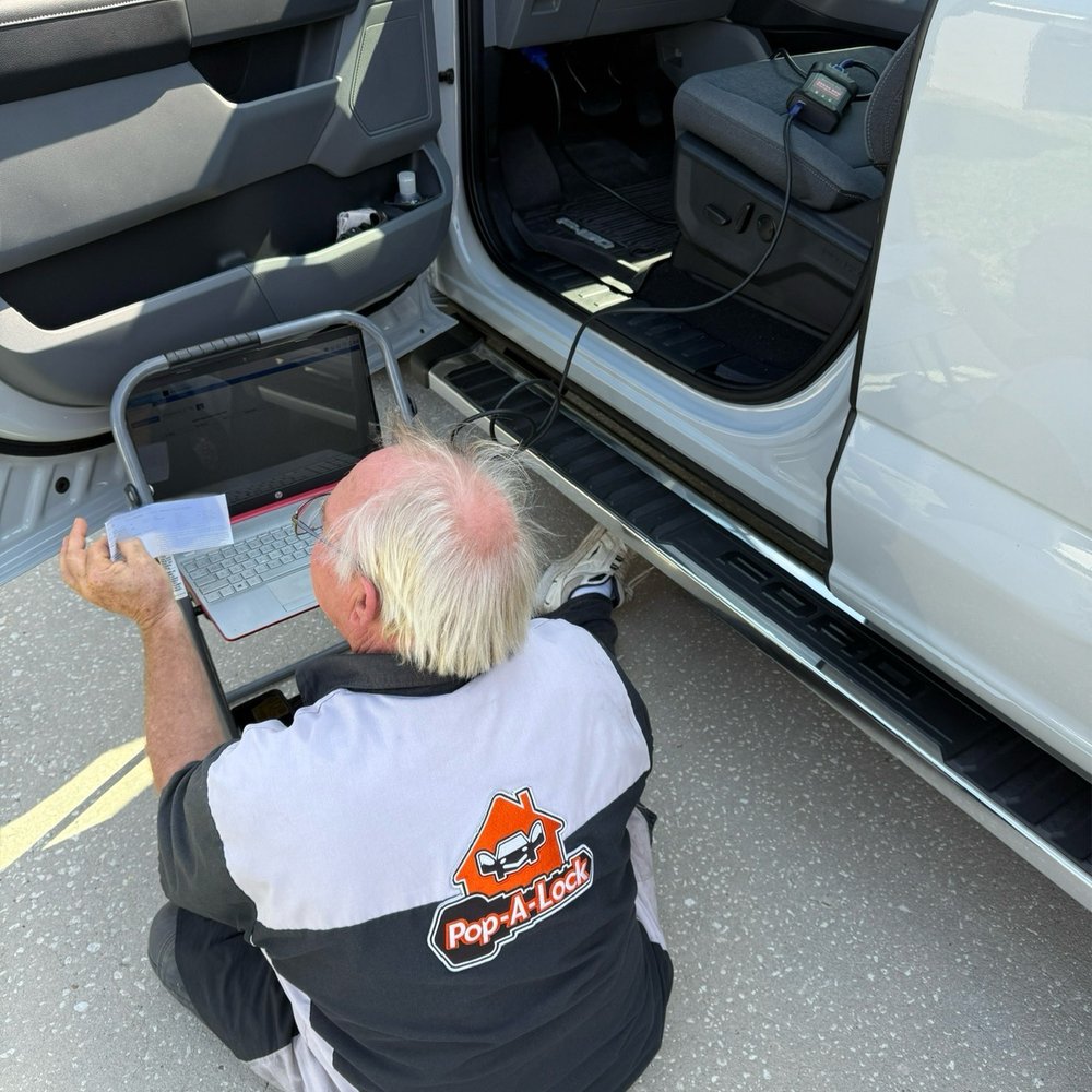 Pop-A-Lock - John downloading information to program the key fob - Keys & Locksmiths Near Me Pop-A-Lock - John downloading information to program the key fob - Keys & Locksmiths Near Me