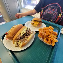 Custard Hut and Pizza - Curly fries, bacon cheese burger, and a Philly cheesesteak