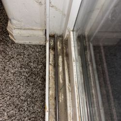 Cleaning Prodigies - Before: Sliding door buildup from pet hair & debris
