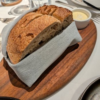 THE CHASTAIN - Double Fermented House Sourdough. Small, $7. Salted cultured butter. - Diners Near Me - Atlanta, Georgia THE CHASTAIN - Double Fermented House Sourdough. Small, $7. Salted cultured butter. - Diners Near Me - Atlanta, Georgia