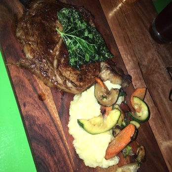 J.T. Prime - 14oz Prime Ribeye Cooked medium paired with Yukon gold potatoes and grilled vegetables - Cocktail Bars Near Me - Yuma, Arizona J.T. Prime - 14oz Prime Ribeye Cooked medium paired with Yukon gold potatoes and grilled vegetables - Cocktail Bars Near Me - Yuma, Arizona