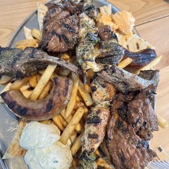 Christopher's Kitchen and Bar - Mixed Grill to Share: lamb, sausage, chicken, steam, pita, fries, hummus, tzatziki, spicy feta - American Near Me - Woonsocket, Rhode Island Christopher's Kitchen and Bar - Mixed Grill to Share: lamb, sausage, chicken, steam, pita, fries, hummus, tzatziki, spicy feta - American Near Me - Woonsocket, Rhode Island