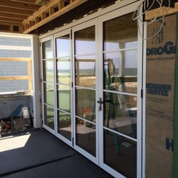 Charles Brown Glass - Custom Stacking NanaWall Door Top off the line Swing door on the right, Remaining three panels stack to the left and out 12' x 8'