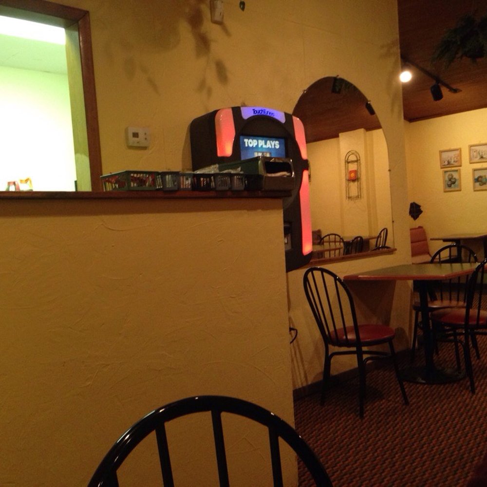 Wings Olé - Dining room jukebox - Chicken Wings Near Me - Fairmont, West Virginia Wings Olé - Dining room jukebox - Chicken Wings Near Me - Fairmont, West Virginia