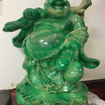 China Garden - a green statue of a laughing buddha - Chinese Near Me - Sarasota, Florida
