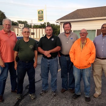Kozy Corners - a group of men standing in a parking lot - American Near Me - Oak Harbor, Ohio