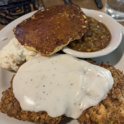 Jaspers Cafe - Chicken fried wagyu steak, garlic cream potatoes, honey-bourbon baked beans, and a cornbread pancake