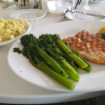 Jetty's Waterfront Restaurant - Grilled Salmon with Broccoli and rice pilaf - Seafood Near Me - Jupiter, Florida Jetty's Waterfront Restaurant - Grilled Salmon with Broccoli and rice pilaf - Seafood Near Me - Jupiter, Florida