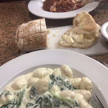Baci Italian Bistro - Gnocchi Florentine in Alfredo sauce heavenly clouds. - Italian Near Me - Mesa, Arizona