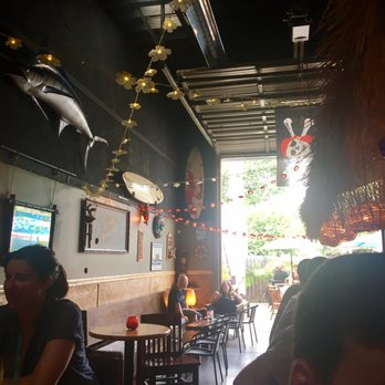 Revolucion - The tiki bar in the back. A must if you can get a table and stand the heat. Made me yearn for a beach vacay! - Mexican Near Me - Indianapolis, Indiana