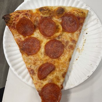 Doria Pizza Restaurant - a slice of pepperoni pizza on a paper plate - Pizza Near Me - Summit, New Jersey