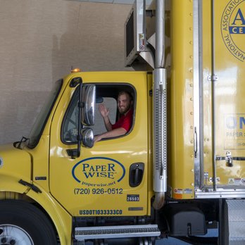 Paper Wise - A driver waving goodbye as he finishes a client's shred. - Shredding Services Near Me - Littleton, Colorado Paper Wise - A driver waving goodbye as he finishes a client's shred. - Shredding Services Near Me - Littleton, Colorado