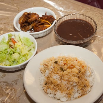 Blessing Caribbean  Restaurant -  plate of rice, salad, and meat - Haitian Near Me - Somerville, Massachusetts