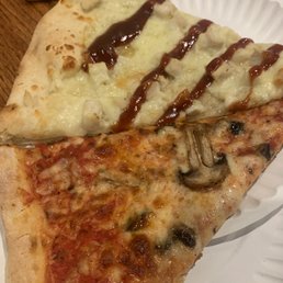two slices of pizza on a paper plate two slices of pizza on a paper plate