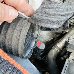 Naoth Automotive - The hole that he said a "rat chewed" through my intake.