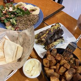 Carnivore platter with side of potatoes