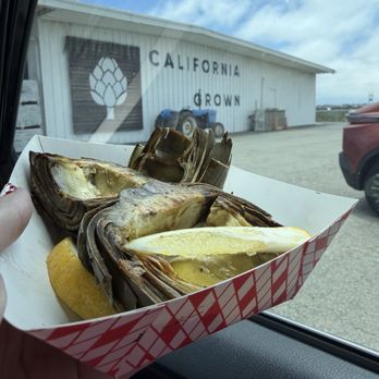 Pezzini Farms - Grilled artichoke from food truck behind - good get the lemon And garlic sauce - Fruits & Veggies Near Me - Castroville, California Pezzini Farms - Grilled artichoke from food truck behind - good get the lemon And garlic sauce - Fruits & Veggies Near Me - Castroville, California