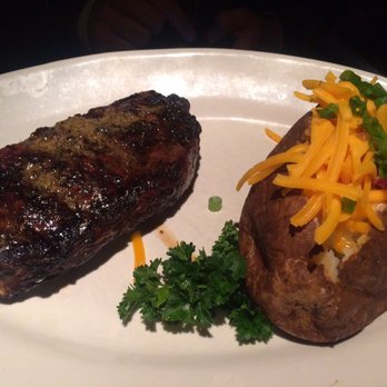 Houston's Restaurant - NY Steak Strip medium with loaded baked potato - New American Near Me - Irvine, California Houston's Restaurant - NY Steak Strip medium with loaded baked potato - New American Near Me - Irvine, California