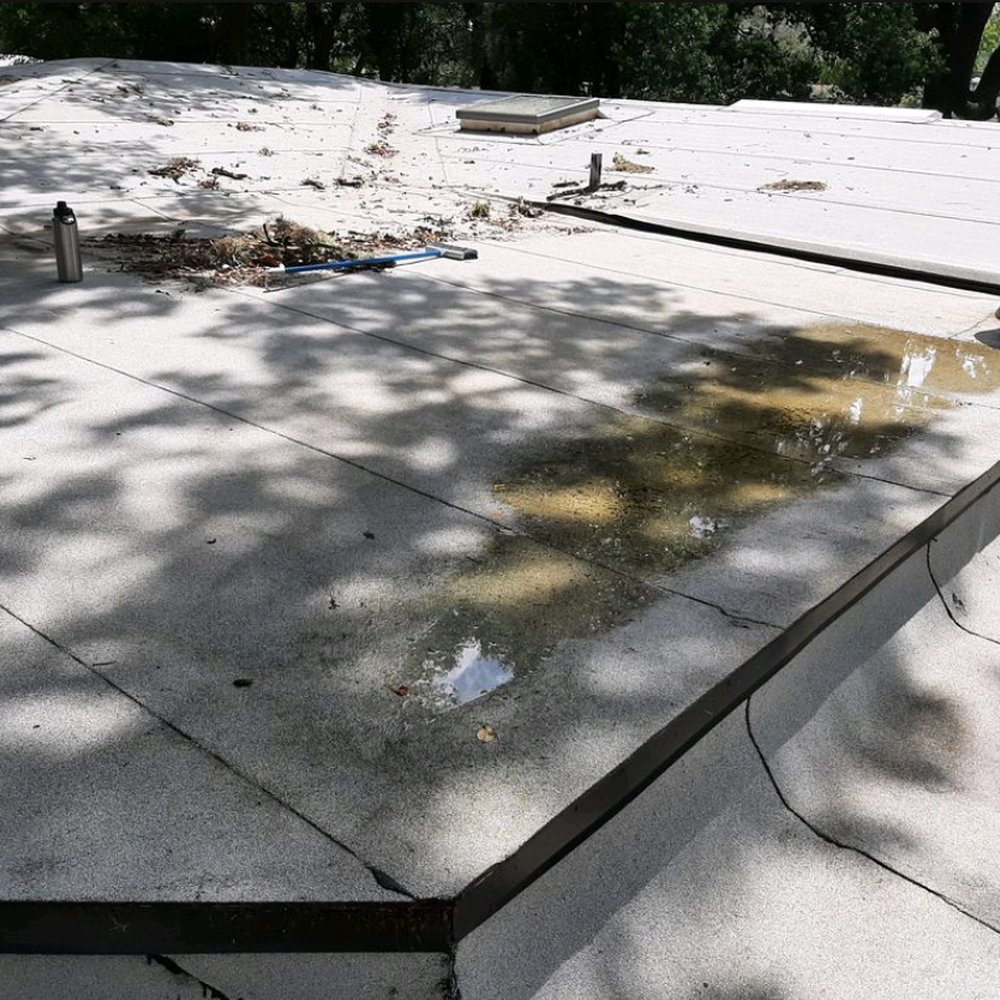Champion Roofing Services - a concrete roof being repaired - Roofing Near Me - Jacksonville, Florida Champion Roofing Services - a concrete roof being repaired - Roofing Near Me - Jacksonville, Florida