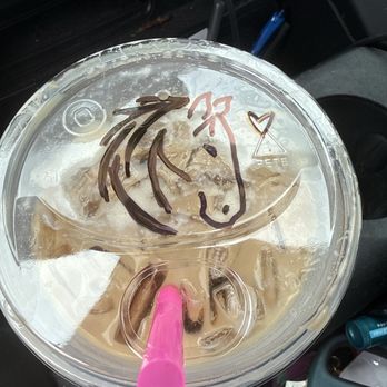 Dutch Bros Coffee - Dutch Bros takeout cup with drawing of a horse head on it and a pink straw. - Juice Bars & Smoothies Near Me - Georgetown, Texas