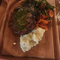 The Silver Fox Steakhouse - Dry aged bone in ribeye with garlic butter and chimichurri