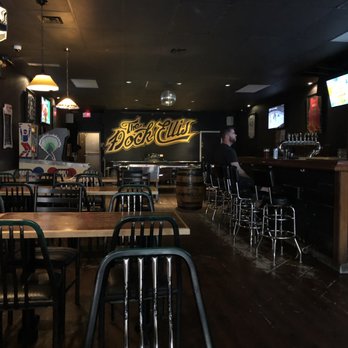 The Dock Ellis - a man sitting at a bar - Sports Bars Near Me - Toronto, Ontario