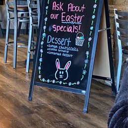 a chalkboard sign for a restaurant a chalkboard sign for a restaurant