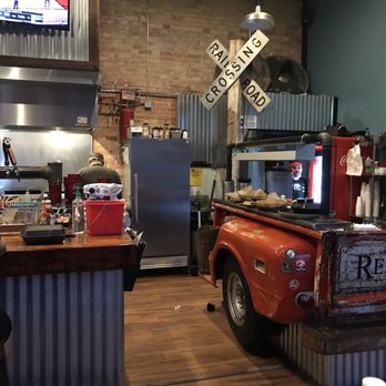 RelicRoad Brewing - Part of the grilling area, small bar, and awesome server station (the truck!) - Breweries Near Me - Winslow, Arizona